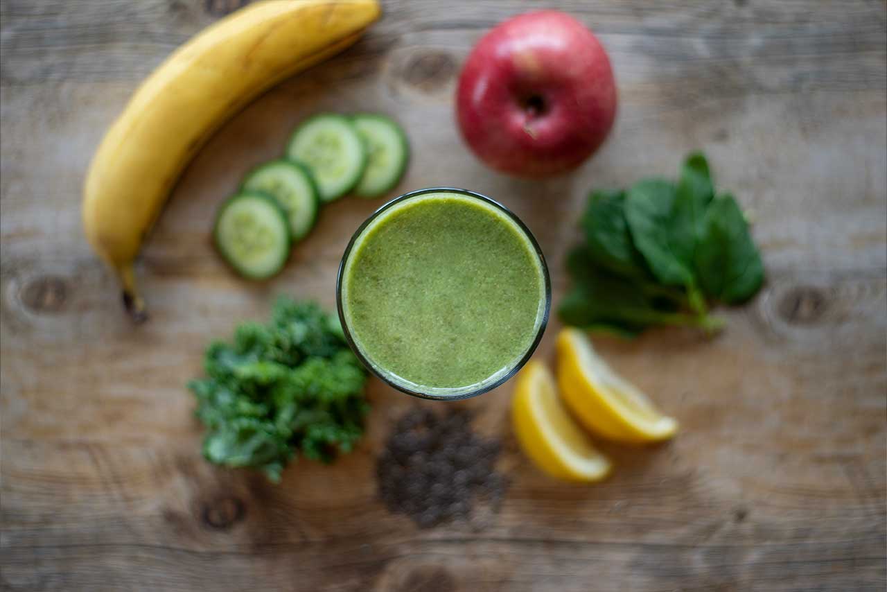 Green smoothie with fresh fruit and veggies
